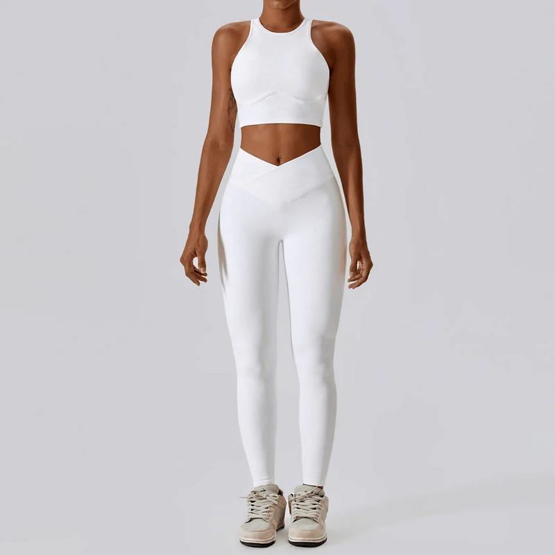 Women's push-up sports bra and ribbed cross leggings in white, perfect for active lifestyles, made from quick-dry nylon and spandex.